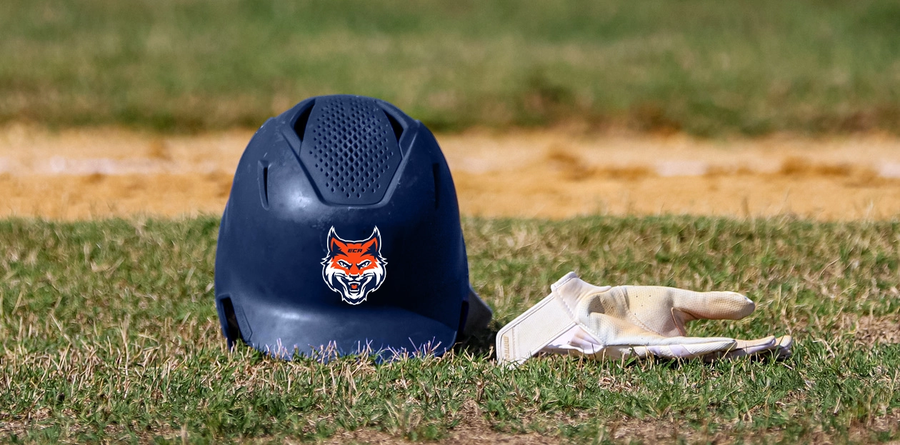 Baseball helmet on a field with ECA logo